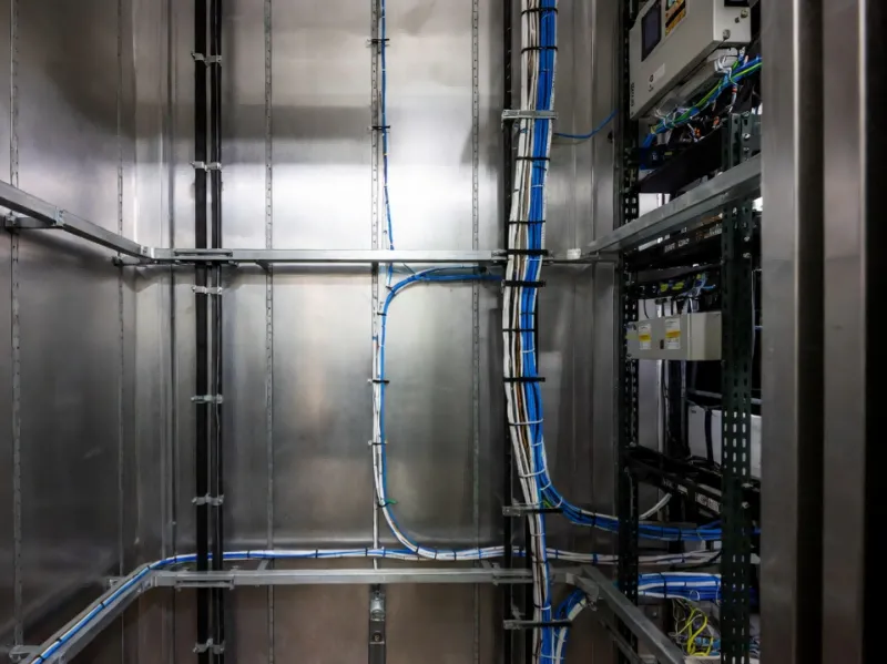 Cat6 CMR riser cable installed in vertical elevator shaft and telecom room conduits showing UL 1666 vertical flame test compliance Cat6 CMR riser cable installed in vertical elevator shaft and telecom room conduits showing UL 1666 vertical flame test compliance